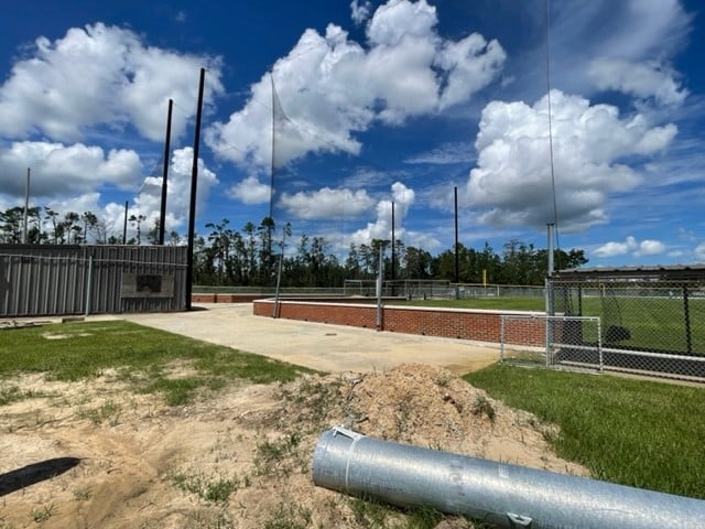 Field 2 brick backstop on 1st base side