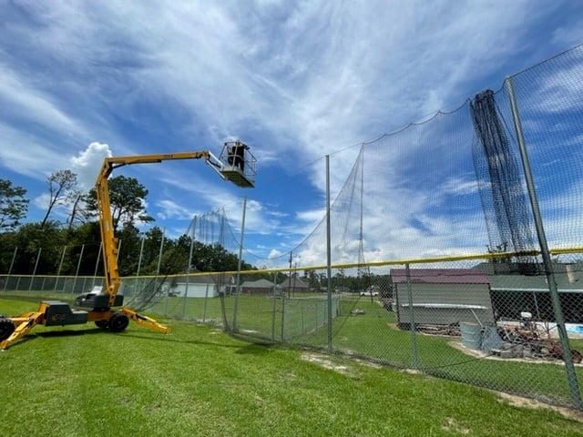 Brand new netting placed above fencing to protect patrons from foul balls